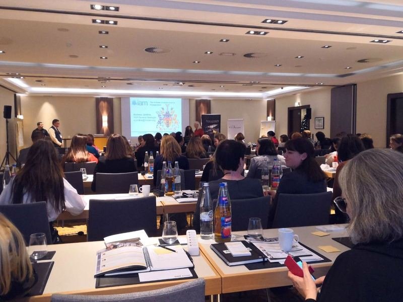 A full room of delegates at an international IAM conference session